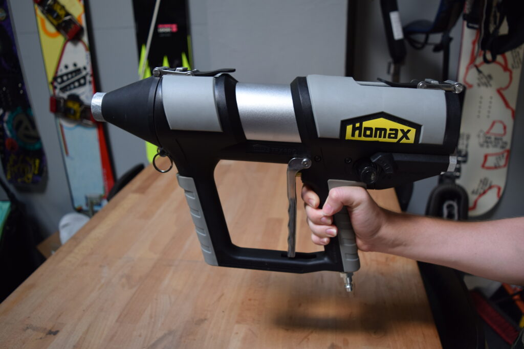 Industrial designer holds production sample of the Homax Tex Pro texture system