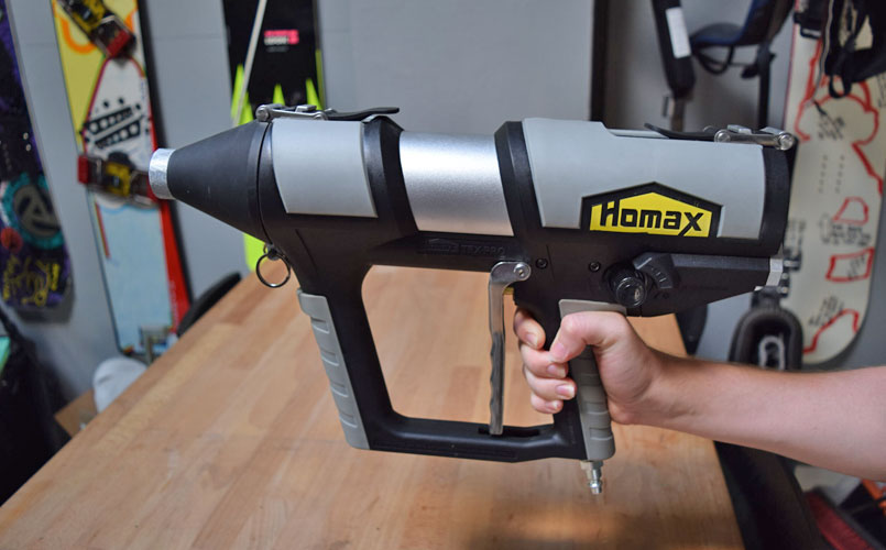 Industrial designer holds production sample of the Homax Tex Pro texture system